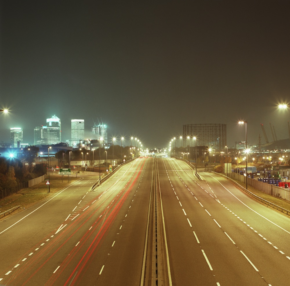 Illustrative stock photograph of an illuminated urban highway at night