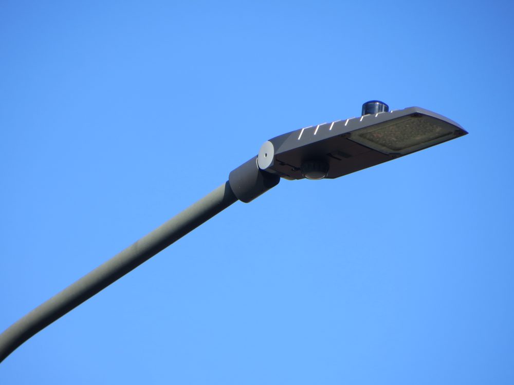 An LED street luminaire with the control node on top and the sensor underneath
