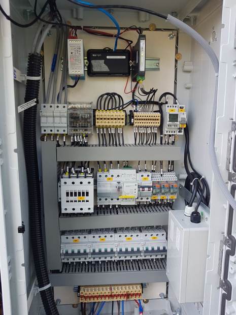 Inside a controlled cabinet: DIN rail with the controller and the protections